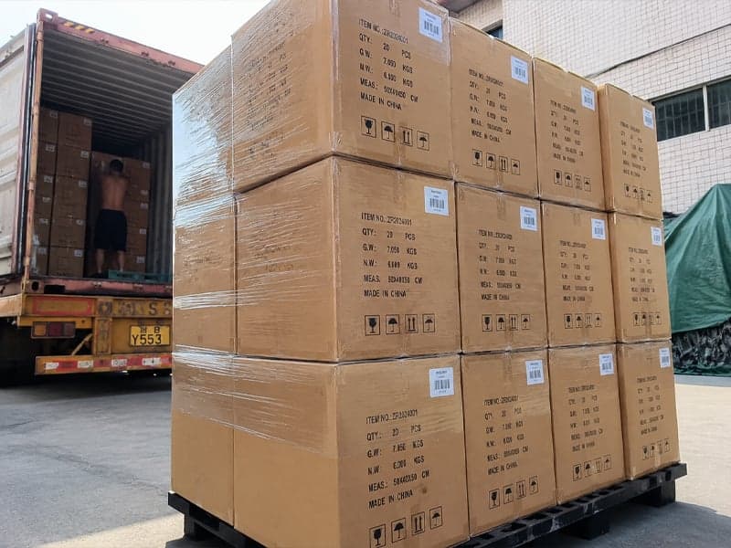 Plush toys palletised and shrink-wrapped in front of the loading container at our Shenzhen warehouse