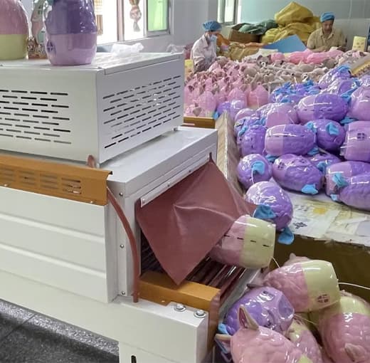 Custom plush toys boxed and palletised for export — retail packaging and master cartons ready to ship