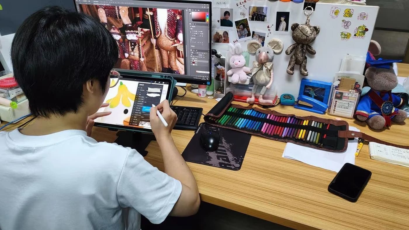 Custom plush toy design and pattern-making — concept art, fabric swatches and paper patterns on the development table
